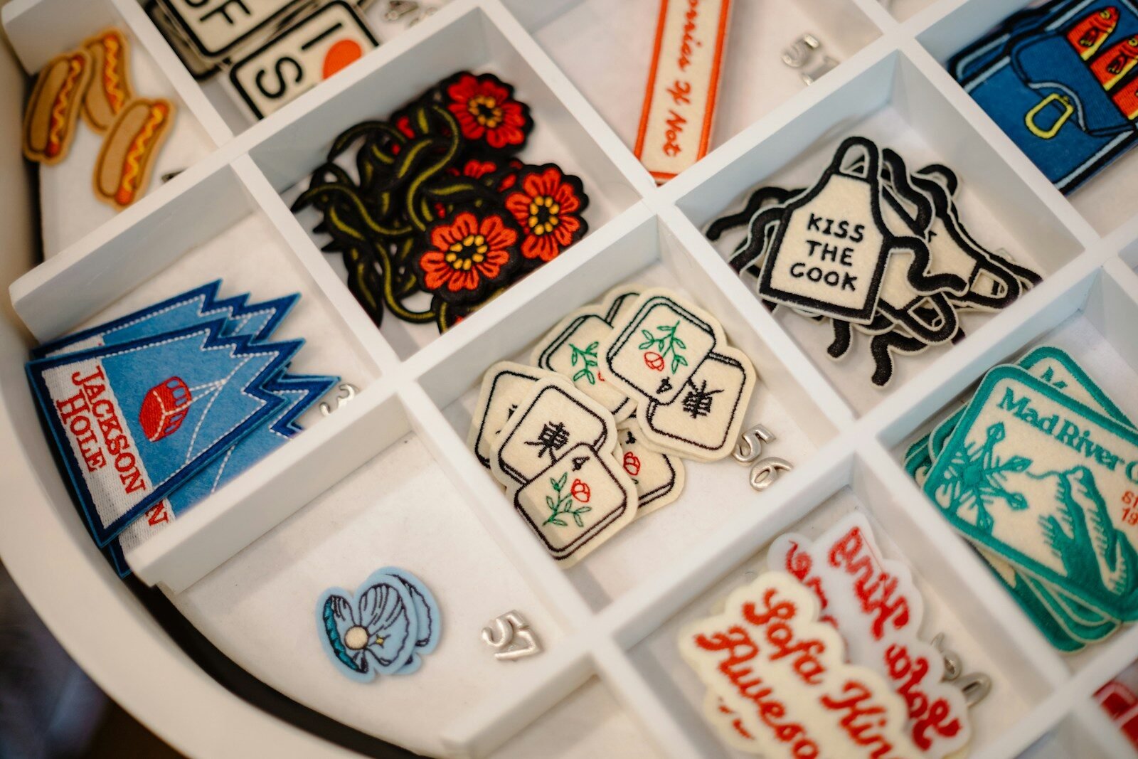 Embroidered patches in a white organizer