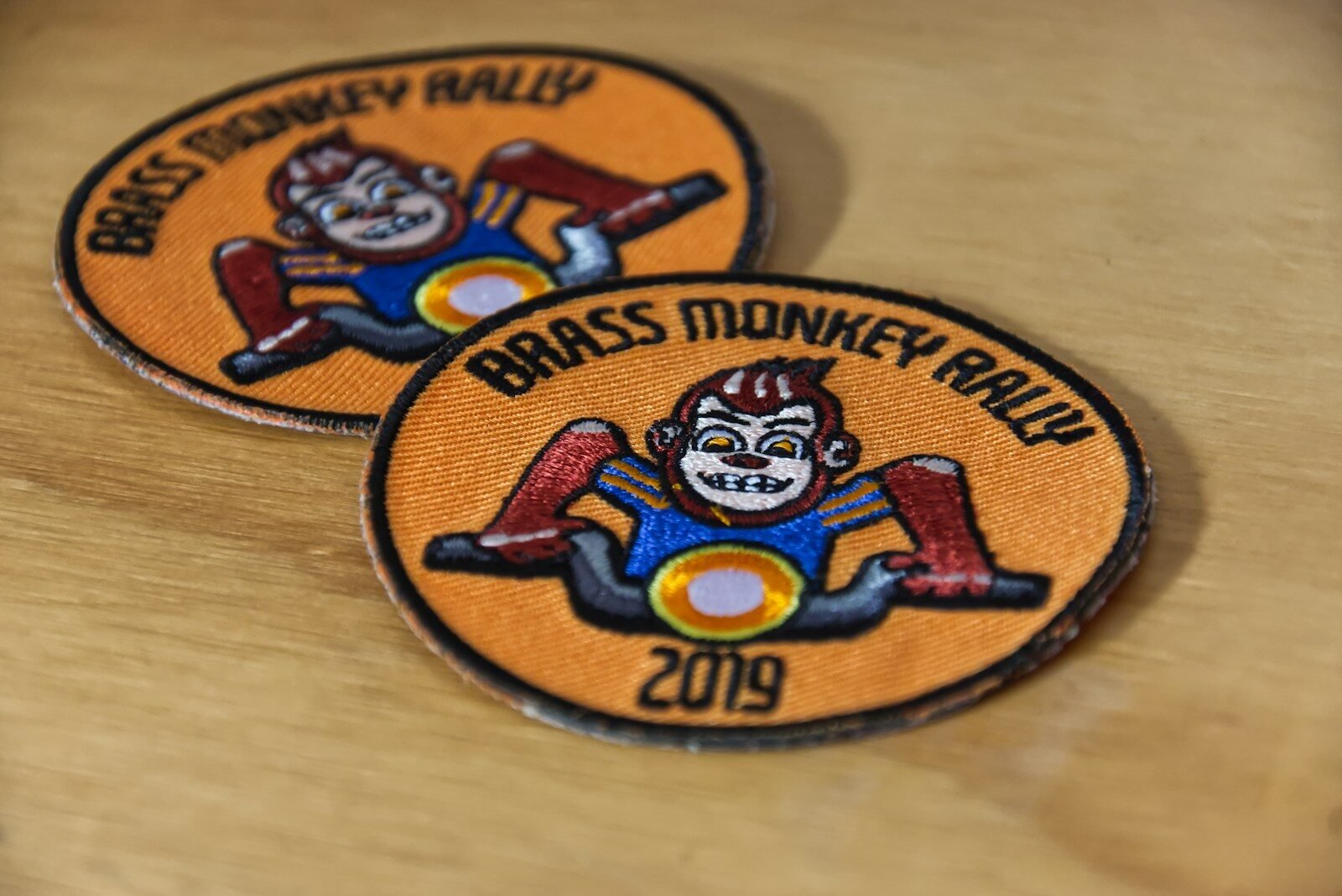 Two embroidered patches on a table