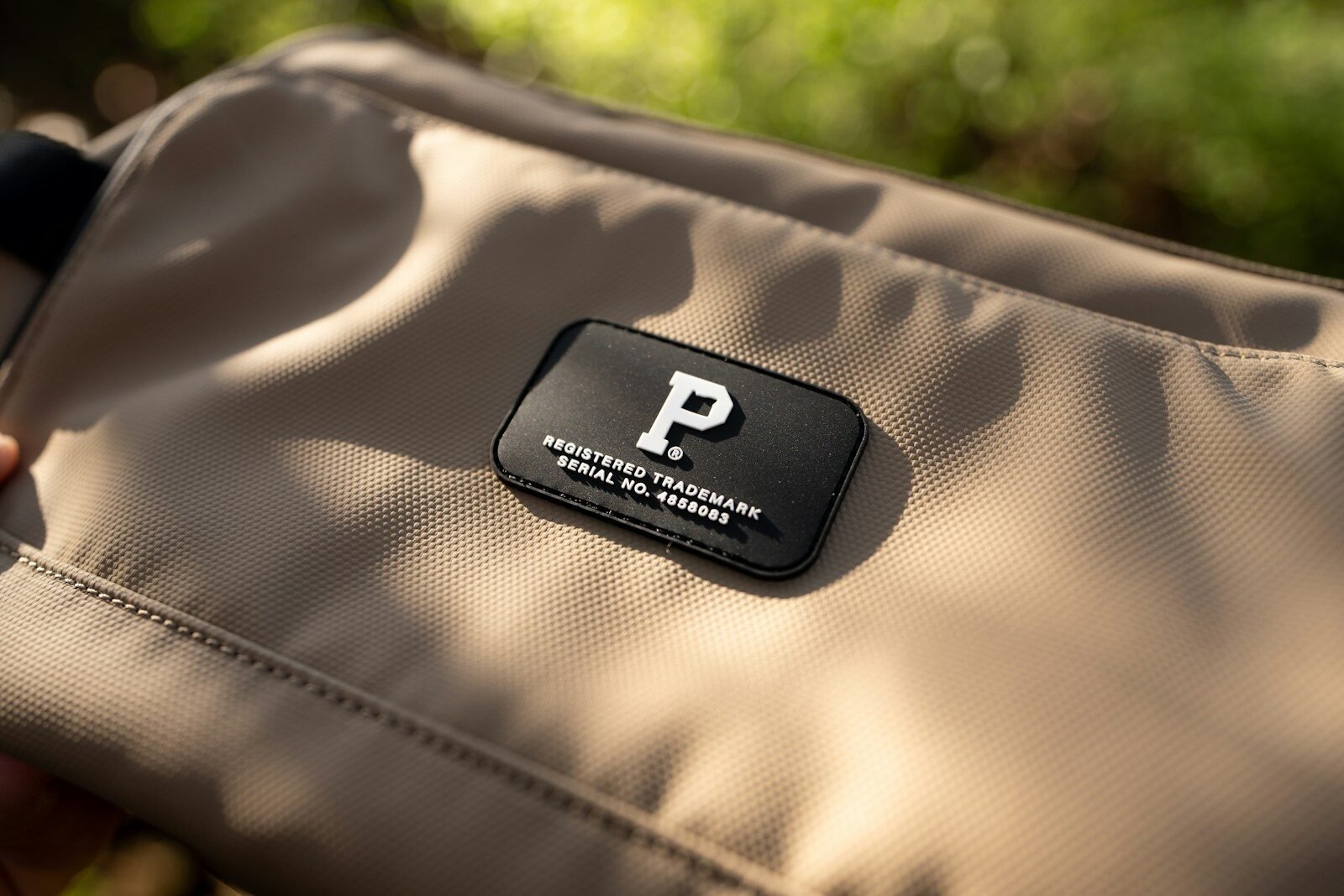 Close-up of a bag with a logo patch